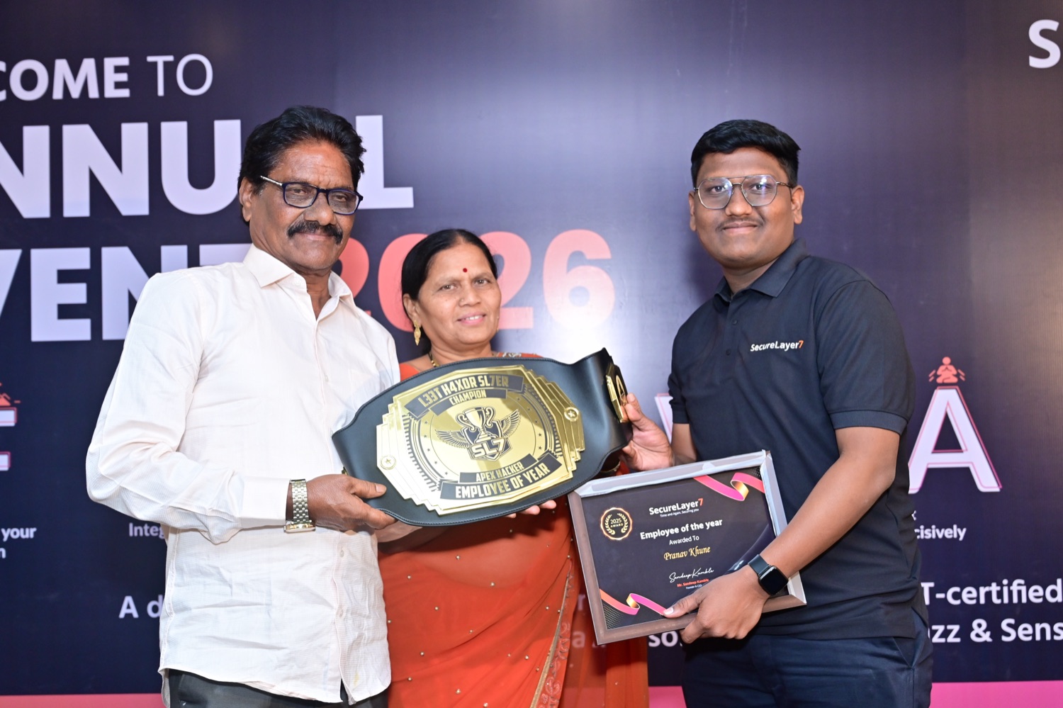 Parents of SecureLayer7 founder Sandeep Kamble presenting the Employee of the Year award to Pranav Khune